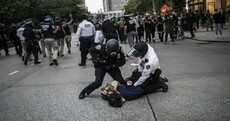 Protesters defy curfews but fewer reports of looting and violence as Trump remains defiant