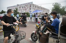 Parts of Beijing locked down after dozens of people test positive for Covid-19