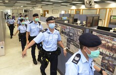 Hong Kong newspaper owner arrested during office raid by police