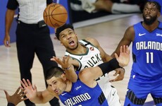 Magic hold on to upset Bucks in playoff opener