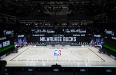 NBA postpone playoff games as players stage boycott in protest at police shooting