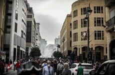 Hundreds march in Lebanon to mark year of protests