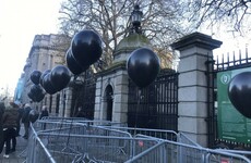 Balloons left outside Leinster House to represent the 56 people who have died in homeless services in Dublin this year