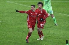 Lewandowski double keeps Bayern in touch with leaders Leverkusen