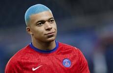 Blue-haired Mbappe helps PSG keep pace