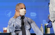 Anthony Fauci gives the thumbs up as he gets the vaccine