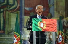 Portugal reelects TV pundit as president, after people brave the pandemic to vote