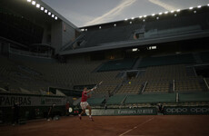 Djokovic eases to opening Roland Garros win on silent night