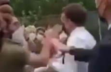 Two people detained after French President Emmanuel Macron slapped across face