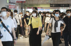 Japan to expand virus emergency one week into Olympics