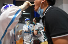 Outbreaks in China and Australia prompt stricter Covid measures