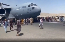 Seven dead at Kabul Airport as videos appear to show people clinging to plane during takeoff
