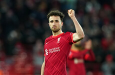 Jota double keeps Liverpool in title hunt, 10-man Arsenal win at Wolves