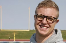 Gay American football player says kiss got him booted