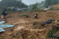 Rescuers search for dozens of missing people after deadly landslide in Indonesia