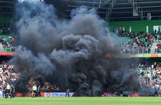 Ajax game abandoned after 9 minutes as smoke bombs thrown