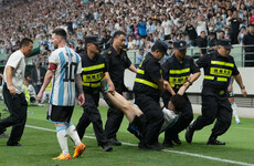 Chinese pitch invader detained after hugging Messi