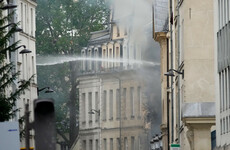 Four people 'fighting for their lives' after suspected gas explosion destroys Paris building