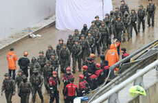 Rescue workers recover last body from flooded South Korean tunnel where 14 people died