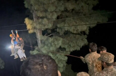 All eight people rescued from cable car dangling for hours over Pakistan ravine