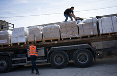 First humanitarian aid rolls into Gaza as Israel vows to increase air strikes