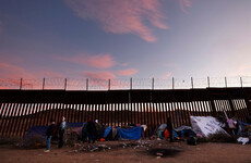 'A new normal': Migrants huddle in open-air camps on US border without food or water