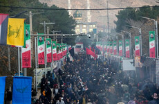 Iranian president joins mourners for funerals of 85 people killed by IS bombings