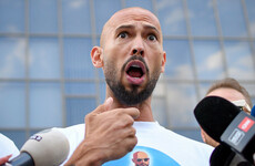 Andrew Tate placed under house arrest in Romania a day after police raided his home