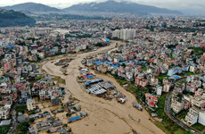 At least 59 people killed in floods and landslides triggered by heavy downpours in Nepal