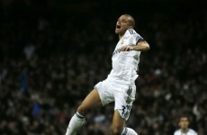 Late Ozil strike earns vital point for Madrid