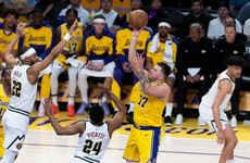 Doncic leads Lakers romp over Nuggets, Kings upset Cavs