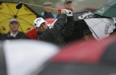 Rain halts McIlroy as Bjorn takes Singapore lead