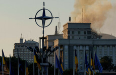 Russia hits Kyiv in largest aerial attack since war began, sparking fire at government building