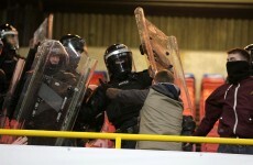 PSNI clash with section of Shamrock Rovers fans during Setanta Cup game at Windsor Park