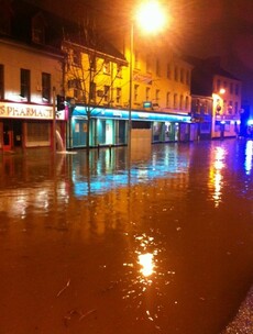 Flash floods and road warnings as heavy rain pours
