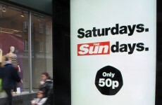 Sun reporter, prison officer charged in British bribery probe