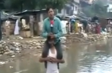 Indian journalist defends TV report filed from shoulders of flood survivor