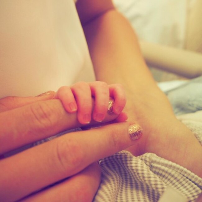 Your little hand's wrapped around my finger and it's so quiet in the world tonight...