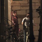 French First Lady Carla Bruni Sarkozy, left, gestures during a scene of the movie