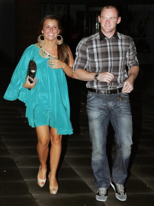 The Rooneys spotted on a night out in Manchester in July. 