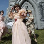 Performers dance outside the inflatable church.
