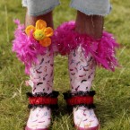 A man shows off his customised wellies.