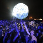 Crowds watch Leftfield headline the main stage on Saturday night.
