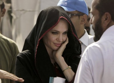 Hollywood actress Angelina Jolie visits a camp for people displaced by the floods near Peshawar, Pakistan.