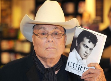 Tony Curtis poses with a copy of his autobiography in October 2008. Curtis died last night aged 85.