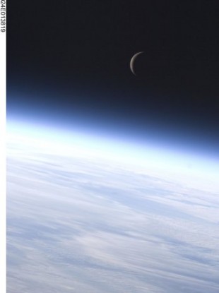 This image provided by NASA shows a last quarter crescent moon above Earth's horizon; photographed by an Expedition 24 crew member on the International Space Station 