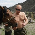 Putin gets acquainted with a horse he rode through the mountains of the Siberian Tyva region on his holidays last year.