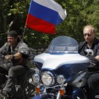 Putin rides a Harley Davidson Lehman Trike as he arrives for the meeting with Russian and Ukrainian motorbikers in the Crimea Peninsula in July.