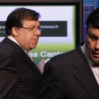 Brian Cowen leads Brian Lenihan off stage after announcing Ireland's bailout application last night. AP Photo/Peter Morrison