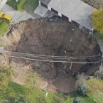 In this aerial photo, a giant landslide under a residential street is seen in Schmalkalden, central Germany. (AP Photo/Jens Meyer)